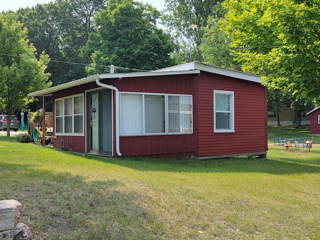 29501 Maplewood Rd Longshore, Unit Longshore, Callaway, MN 56521 - view of home's exterior featuring a yard