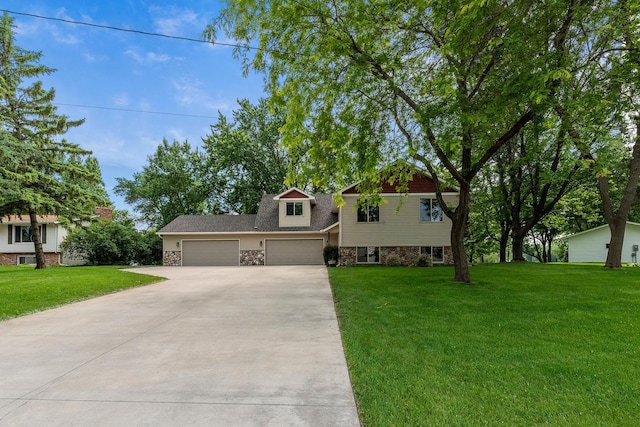 818 Myrtle St, Buffalo, MN 55313 - view of front of house with driveway, a garage, a front lawn, and stone siding