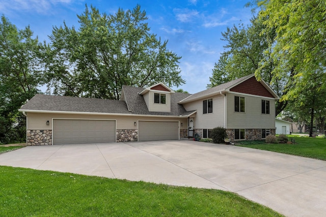 818 Myrtle St, Buffalo, MN 55313 - view of front of home featuring stone siding, a garage, concrete driveway, and a front lawn