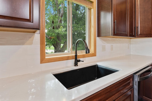 818 Myrtle St, Buffalo, MN 55313 - kitchen featuring decorative backsplash, dishwasher, and dark brown cabinets