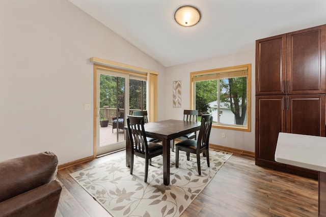 818 Myrtle St, Buffalo, MN 55313 - dining space with lofted ceiling, healthy amount of natural light, and light wood finished floors