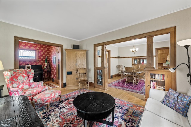 5043 Nokomis Ave, Minneapolis, MN 55417 - living area with light wood-type flooring, ornamental molding, decorative columns, and a chandelier