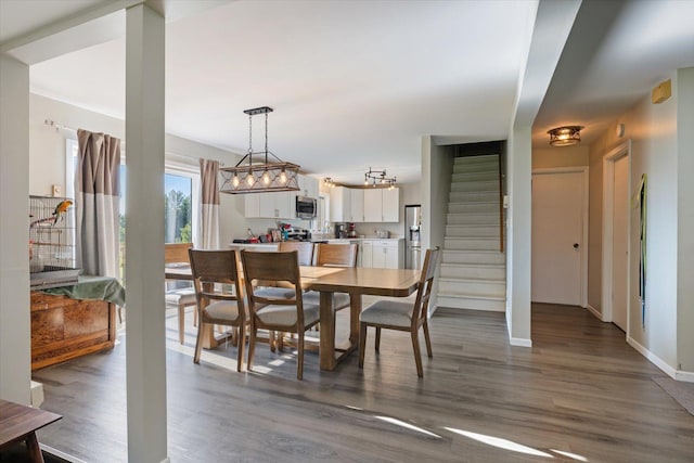 4069 Dublin Rd, Hibbing, MN 55746 - dining space with stairway and dark wood-type flooring