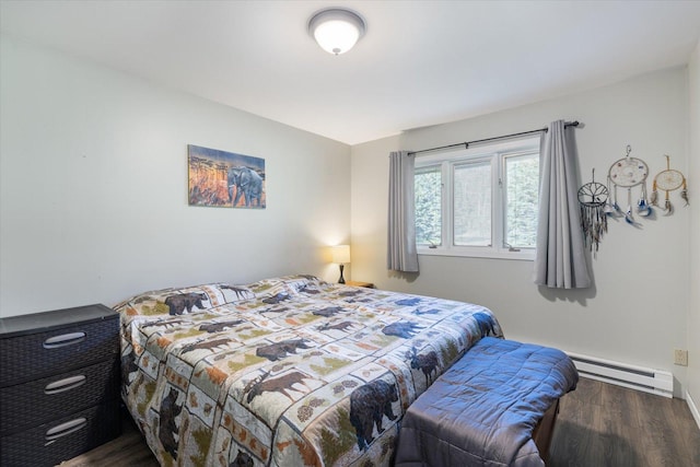 4069 Dublin Rd, Hibbing, MN 55746 - bedroom with a baseboard heating unit and wood finished floors