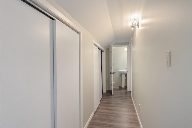 4069 Dublin Rd, Hibbing, MN 55746 - hallway with baseboards and dark wood-style flooring