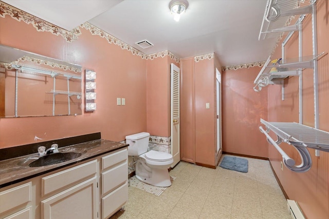 4069 Dublin Rd, Hibbing, MN 55746 - bathroom with tile patterned floors, vanity, and a baseboard radiator