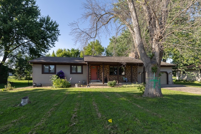 1478 Walnut St, Prescott, WI 54021 - ranch-style home with an attached garage, covered porch, driveway, and a front lawn