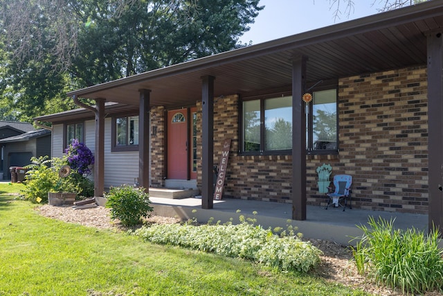 1478 Walnut St, Prescott, WI 54021 - view of front of home featuring a porch, a front yard, and brick siding
