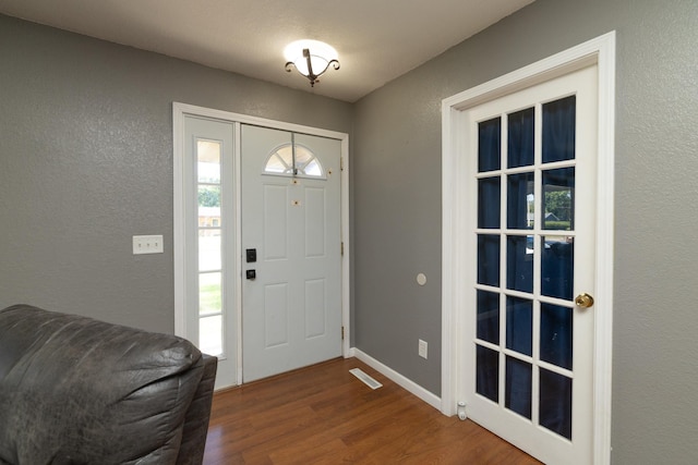 1478 Walnut St, Prescott, WI 54021 - foyer entrance featuring wood finished floors and a textured wall