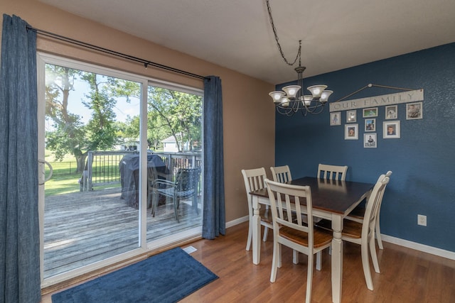 1478 Walnut St, Prescott, WI 54021 - dining area featuring a chandelier and wood finished floors