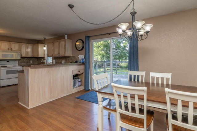 1478 Walnut St, Prescott, WI 54021 - dining space featuring a chandelier and dark wood-style flooring