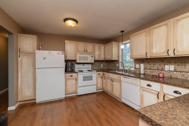 1478 Walnut St, Prescott, WI 54021 - kitchen featuring white appliances, light brown cabinetry, dark wood-style floors, and dark countertops