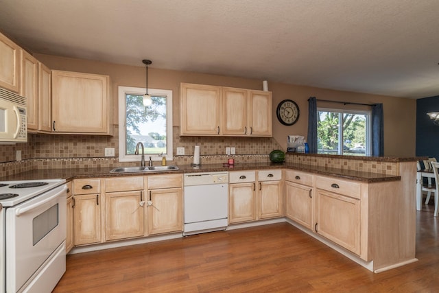 1478 Walnut St, Prescott, WI 54021 - kitchen featuring white appliances, light brown cabinets, a peninsula, and backsplash