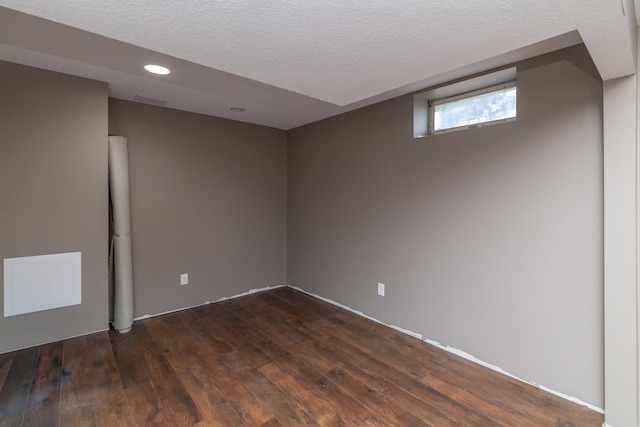1478 Walnut St, Prescott, WI 54021 - below grade area featuring dark wood finished floors, a textured ceiling, and recessed lighting