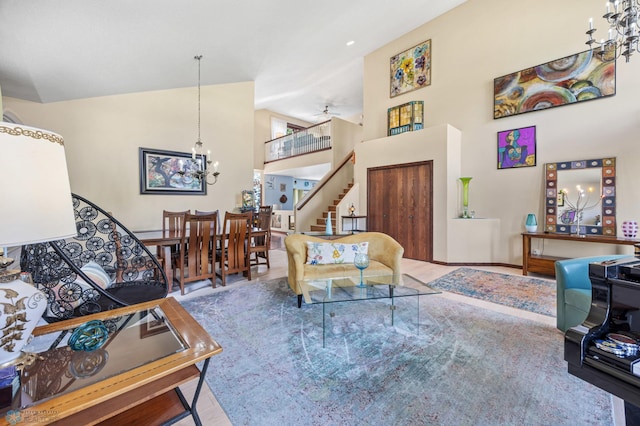 525 20 1/2 Ave E, West Fargo, ND 58078 - living room featuring a chandelier, high vaulted ceiling, and stairway