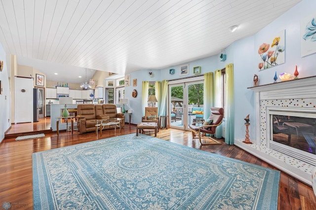 525 20 1/2 Ave E, West Fargo, ND 58078 - living room with a tiled fireplace, wooden ceiling, wood finished floors, french doors, and a chandelier