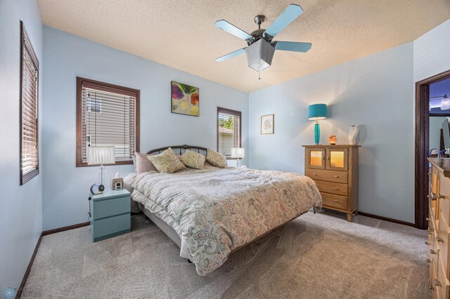 525 20 1/2 Ave E, West Fargo, ND 58078 - bedroom featuring carpet, ceiling fan, and a textured ceiling