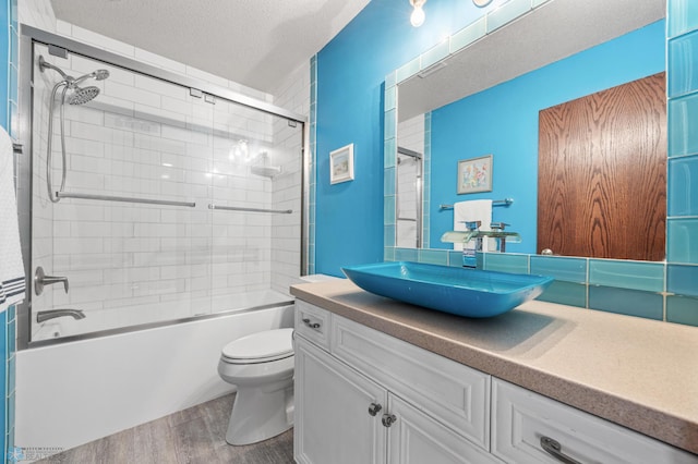 525 20 1/2 Ave E, West Fargo, ND 58078 - full bathroom featuring wood finished floors, vanity, shower / bath combination, and a textured ceiling