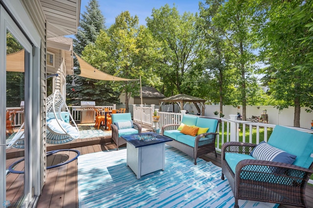 525 20 1/2 Ave E, West Fargo, ND 58078 - deck with an outdoor living space with a fire pit, a gazebo, and a fenced backyard