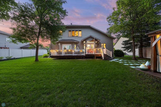 525 20 1/2 Ave E, West Fargo, ND 58078 - back of property at dusk featuring a wooden deck