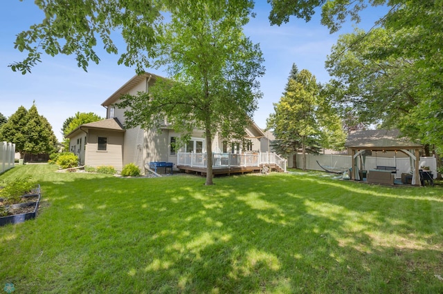 525 20 1/2 Ave E, West Fargo, ND 58078 - fenced backyard featuring a gazebo, a wooden deck, and outdoor lounge area