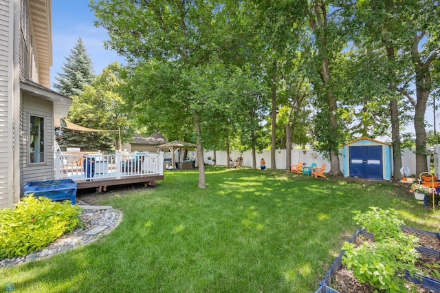525 20 1/2 Ave E, West Fargo, ND 58078 - fenced backyard featuring a shed, a gazebo, and a wooden deck