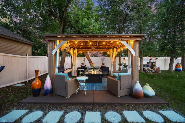 525 20 1/2 Ave E, West Fargo, ND 58078 - fenced backyard featuring a gazebo and an outdoor living space with a fire pit