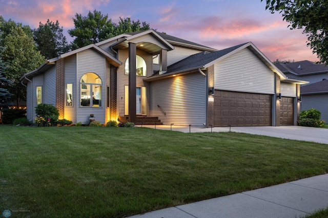 525 20 1/2 Ave E, West Fargo, ND 58078 - view of front of home featuring a garage, a front lawn, and driveway