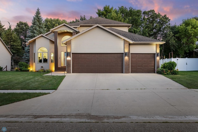 525 20 1/2 Ave E, West Fargo, ND 58078 - view of front of property with an attached garage, driveway, and brick siding
