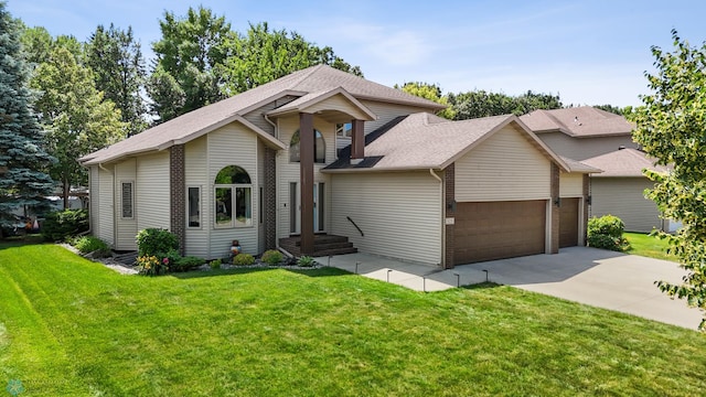 525 20 1/2 Ave E, West Fargo, ND 58078 - view of front facade with a garage, a front yard, concrete driveway, and roof with shingles