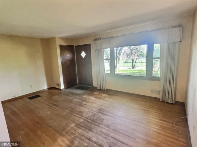 1938 149th Ave NE, Ham Lake, MN 55304 - spare room featuring wood finished floors
