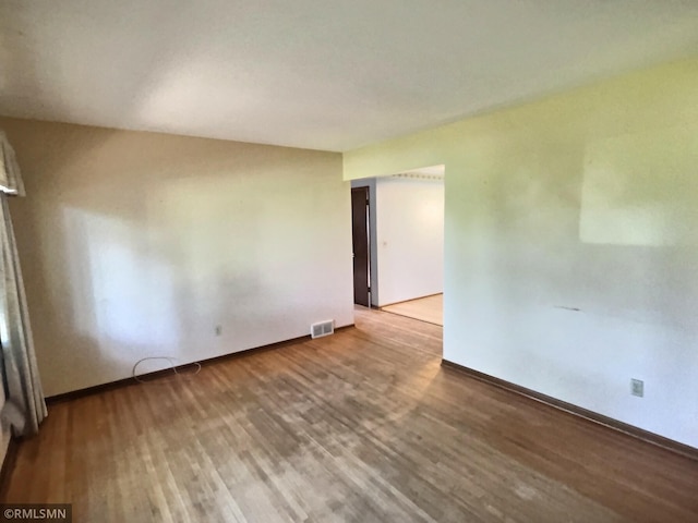 1938 149th Ave NE, Ham Lake, MN 55304 - unfurnished room with wood finished floors and baseboards