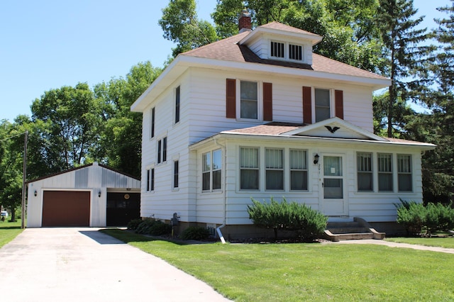 201 3rd St SE, Renville, MN 56284 - american foursquare style home featuring an outbuilding, a chimney, a garage, entry steps, and a front yard