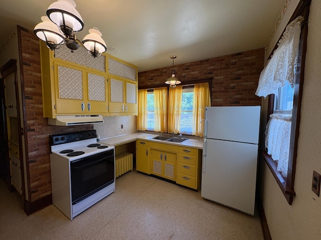 201 3rd St SE, Renville, MN 56284 - kitchen with white appliances, under cabinet range hood, radiator, a chandelier, and light countertops