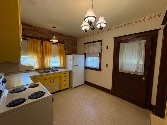 201 3rd St SE, Renville, MN 56284 - kitchen featuring white appliances, light countertops, and a chandelier