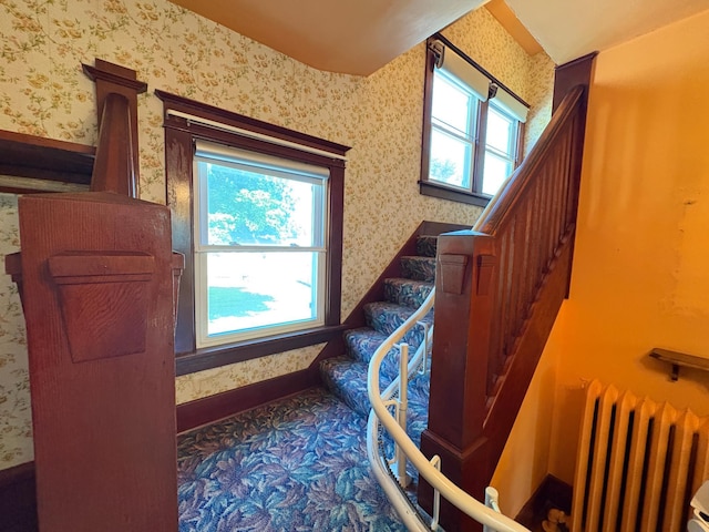 201 3rd St SE, Renville, MN 56284 - stairs with radiator and wallpapered walls