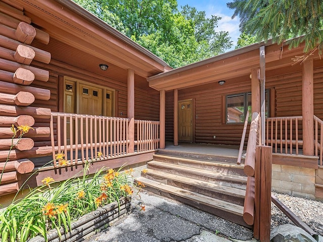 20980 Parkfield Ave, Spring Lake Twp, MN 55352 - doorway to property with covered porch and log siding