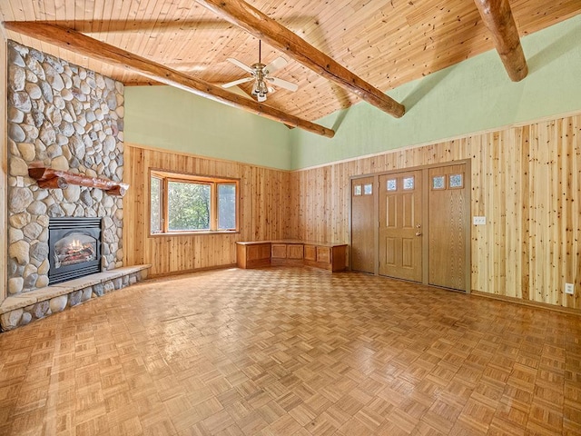 20980 Parkfield Ave, Spring Lake Twp, MN 55352 - unfurnished living room featuring a wooden ceiling with exposed beams, high vaulted ceiling, ceiling fan, a stone fireplace, and wooden walls