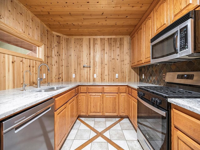 20980 Parkfield Ave, Spring Lake Twp, MN 55352 - kitchen featuring stainless steel appliances, wooden ceiling, light tile patterned flooring, light stone counters, and wood walls