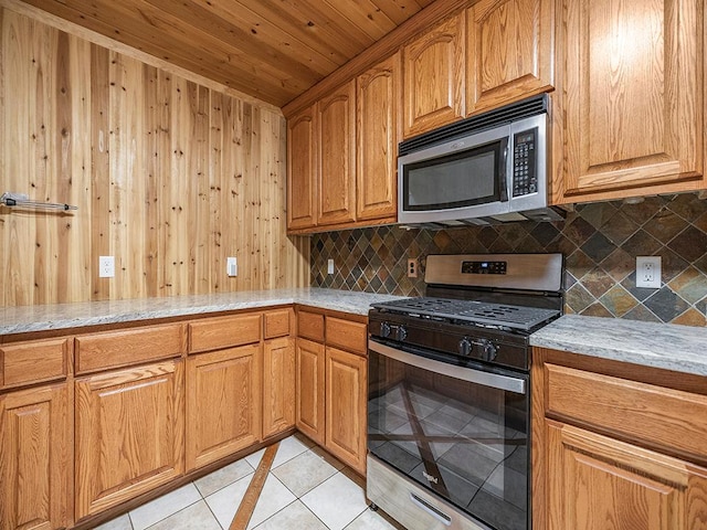 20980 Parkfield Ave, Spring Lake Twp, MN 55352 - kitchen with appliances with stainless steel finishes, decorative backsplash, light stone counters, wooden walls, and wood ceiling