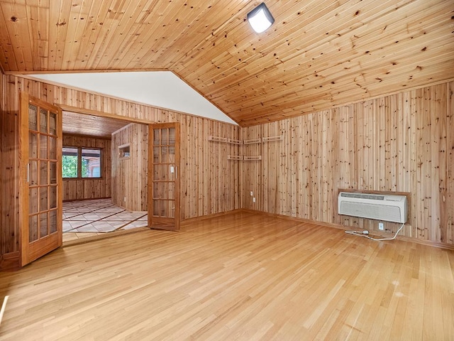 20980 Parkfield Ave, Spring Lake Twp, MN 55352 - spare room featuring wooden walls, wood finished floors, vaulted ceiling, a wall mounted air conditioner, and wooden ceiling