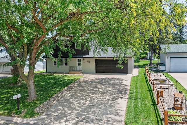 724 2nd Ave S, Buffalo, MN 55313 - view of front of property featuring concrete driveway, a front lawn, stucco siding, and a shingled roof