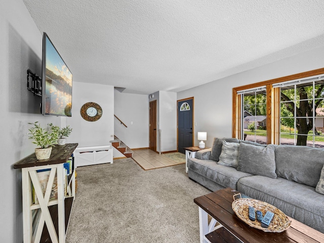 724 2nd Ave S, Buffalo, MN 55313 - living room featuring a textured ceiling, stairs, and carpet flooring