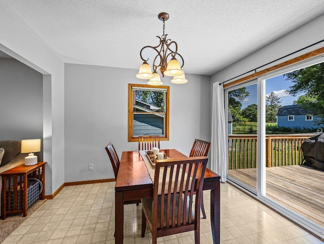 724 2nd Ave S, Buffalo, MN 55313 - dining room featuring a chandelier, a textured ceiling, and light flooring