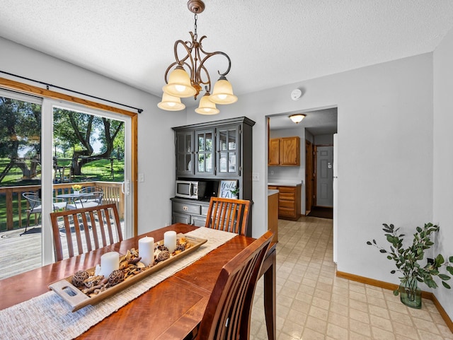 724 2nd Ave S, Buffalo, MN 55313 - dining room with a chandelier, a textured ceiling, and light flooring