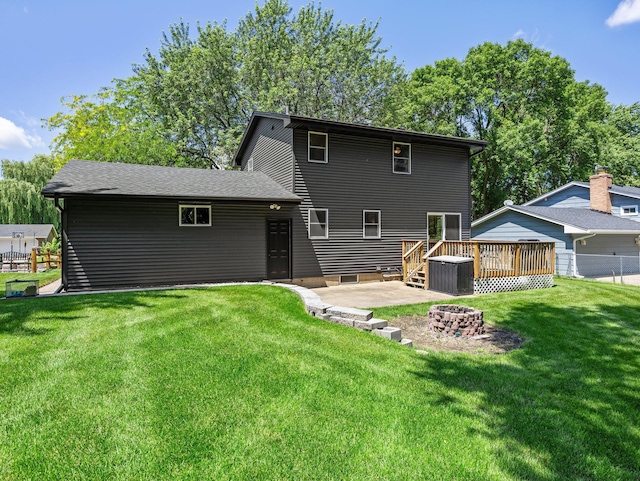 724 2nd Ave S, Buffalo, MN 55313 - back of property featuring an outdoor fire pit, a patio area, and a wooden deck