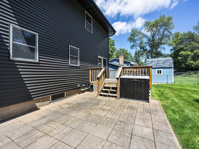 724 2nd Ave S, Buffalo, MN 55313 - back of property with a patio area, a deck, and a storage unit