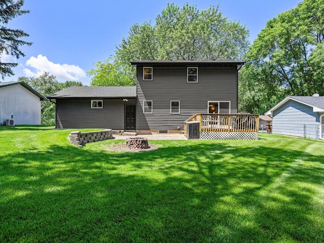 724 2nd Ave S, Buffalo, MN 55313 - rear view of property with a wooden deck, a yard, and a fire pit