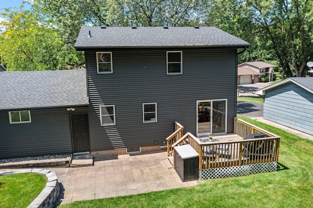 724 2nd Ave S, Buffalo, MN 55313 - back of house with roof with shingles, a lawn, a wooden deck, and a patio area