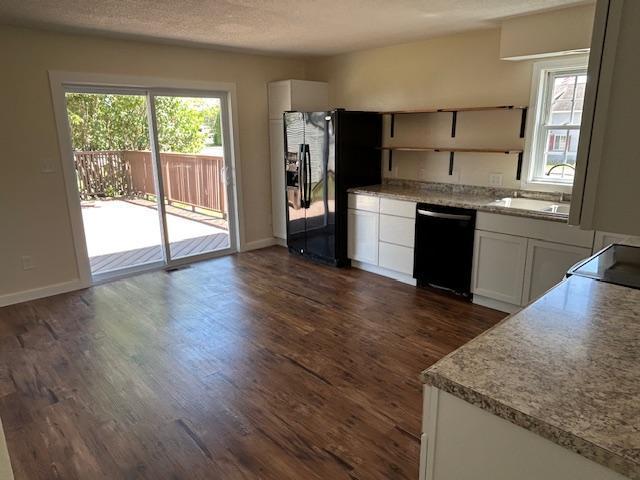 504 8th Ave, Grand Rapids, MN 55744 - kitchen with black appliances, open shelves, dark wood-style floors, white cabinets, and light countertops